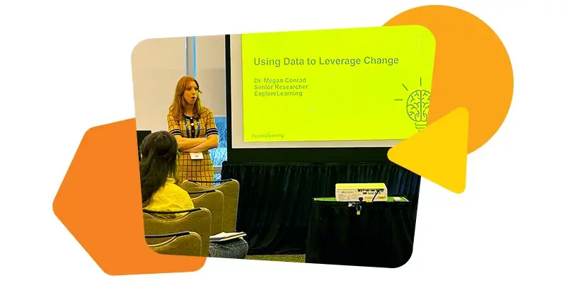 Dr. Megan Conrad holding a presentation. She is standing next to a projector screen.