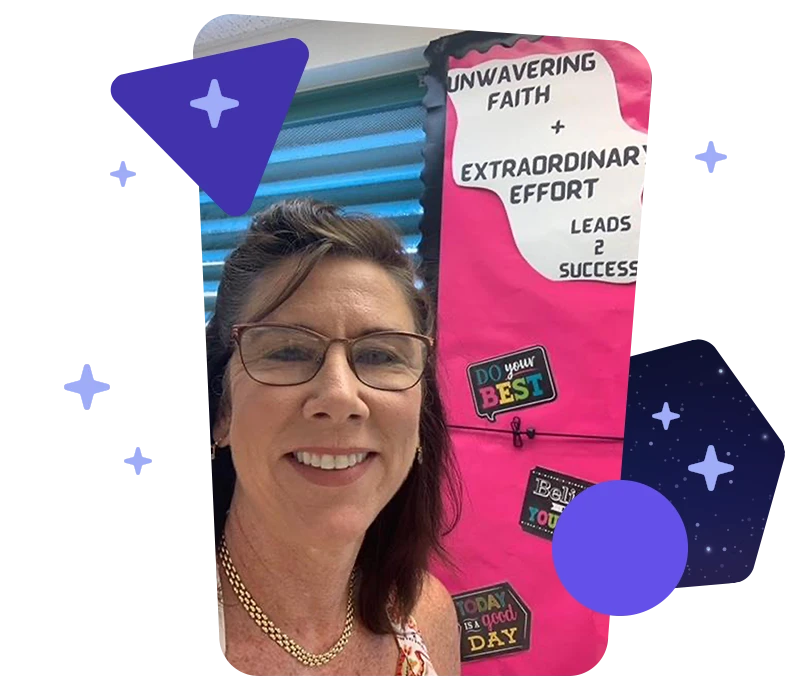 Photo of Teresa Murphy in front of a motivating bulletin board with the message: Unwavering Faith + Extraordinary Effort leads to success